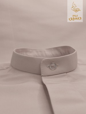 Side view of the standing collar with mother-of-pearl button