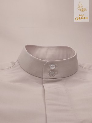 Close-up of the standing collar with double button placket