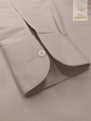 Close-up of the cuff fold construction with round button